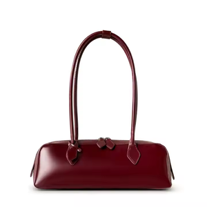 Custom Women's 2025 Neues koreanisches Nischendesign One-Shoulder große Kapazität Cowide Achselbeutel Langer roter Baguett-Tasche